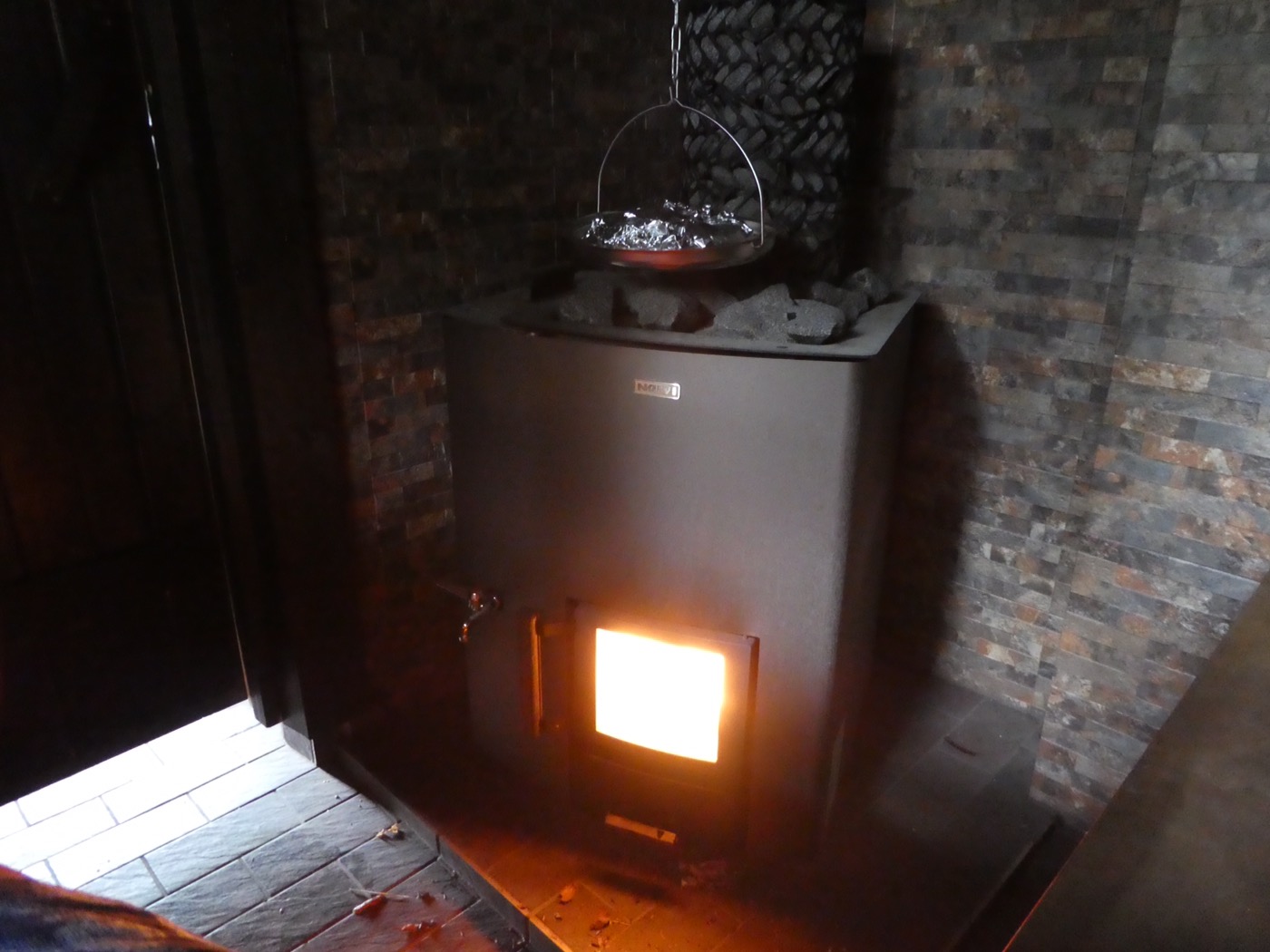 Sausages cooking on the sauna oven 
