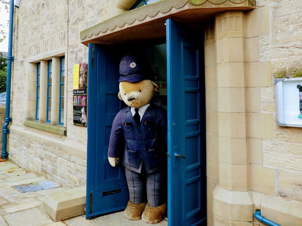 Entrance to Ilkley Toy Museum with police bear